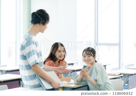 College students talking with classmates in the classroom. Photo courtesy of Denpa Gakuen, Tokyo Electronics College. College students talking with classmates in the classroom. Photo courtesy of Denpa Gakuen, Tokyo Electronics College. 118606932