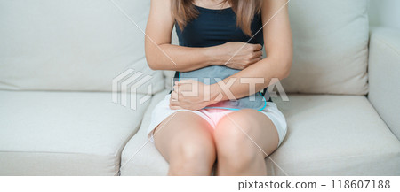 Menstruation period cycle of monthly and Stomachache concepts. woman having abdomen pain and menstrual ache with hot water bottle, illness female suffer from premenstrual ache and body Health problem 118607188
