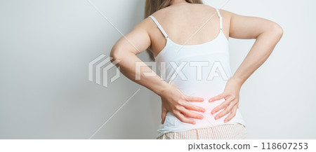 woman having back body ache during at home. adult female with muscle pain due to Piriformis Syndrome, Low Back Pain and Spinal Compression. Office syndrome and medical concept 118607253