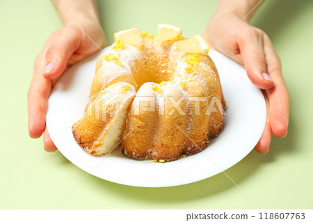 Tasty bake food concept - delicious lemon cake 118607763