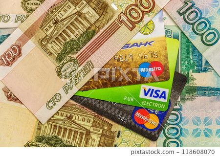 Bank cards Maestro, VISA and MasterCard with cash notes 118608070
