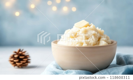 Creamy Mashed Potatoes with Butter in a White Bowl on a Festive Background Creamy Mashed Potatoes with Butter in a White Bowl on a Festive Background 118608311