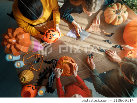 Happy family preparing for Halloween. Happy family preparing for Halloween. 118609114