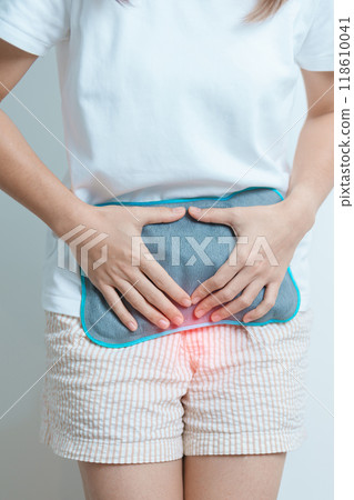 Menstruation period cycle of monthly and Stomachache concepts. woman having abdomen pain and menstrual ache with hot water bottle, illness female suffer from premenstrual ache and body Health problem 118610041