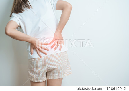 woman having back body ache during at home. adult female with muscle pain due to Piriformis Syndrome, Low Back Pain and Spinal Compression. Office syndrome and medical concept 118610042