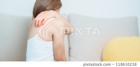 Woman having Shoulder and Neck pain at home. Muscle painful due to Myofascial pain syndrome and Fibromyalgia, rheumatism, Scapular pain, Cervical Spine. ergonomic concept 118610238
