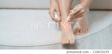 Arthritis and Muscle Pain Relief Cream concept. woman having leg pain due to Ankle Sprains or Achilles Tendonitis and Shin Splints ache. injuries, health and medical concept Arthritis and Muscle Pain Relief Cream concept. woman having leg pain due to Ankle Sprains or Achilles Tendonitis and Shin Splints ache. injuries, health and medical concept 118610245
