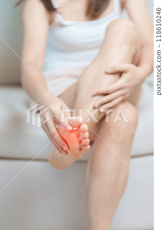 woman having barefoot pain at home. Foot ache due to Plantar fasciitis and waking longtime. Health and medical concept woman having barefoot pain at home. Foot ache due to Plantar fasciitis and waking longtime. Health and medical concept 118610246