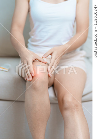 Arthritis and Muscle Pain Relief Cream concept. woman having knee ache and muscle pain due to Runners Knee or Patellofemoral Pain Syndrome, osteoarthritis, rheumatism and Patellar Tendinitis Arthritis and Muscle Pain Relief Cream concept. woman having knee ache and muscle pain due to Runners Knee or Patellofemoral Pain Syndrome, osteoarthritis, rheumatism and Patellar Tendinitis 118610247