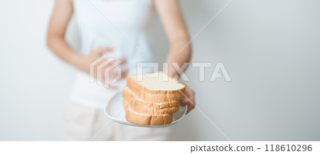 Gluten intolerance, Gluten free and celiac disease or wheat allergy concept. woman hold Bread and having abdominal pain after eat gluten. stomach ache, Nausea, Bloating, Gas, Diarrhea and Skin rash Gluten intolerance, Gluten free and celiac disease or wheat allergy concept. woman hold Bread and having abdominal pain after eat gluten. stomach ache, Nausea, Bloating, Gas, Diarrhea and Skin rash 118610296