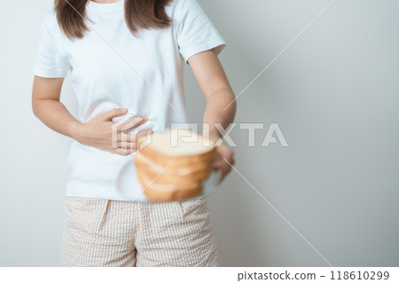 Gluten intolerance, Gluten free and celiac disease or wheat allergy concept. woman hold Bread and having abdominal pain after eat gluten. stomach ache, Nausea, Bloating, Gas, Diarrhea and Skin rash Gluten intolerance, Gluten free and celiac disease or wheat allergy concept. woman hold Bread and having abdominal pain after eat gluten. stomach ache, Nausea, Bloating, Gas, Diarrhea and Skin rash 118610299
