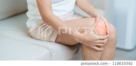 woman having knee ache and muscle pain due to Runners Knee or Patellofemoral Pain Syndrome, osteoarthritis, arthritis, rheumatism and Patellar Tendinitis. medical concept 118610392