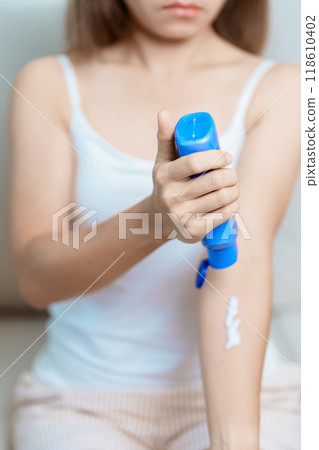 Skin care lotion and Skin body cream Moisturizing, Sunscreen and Healthy Daily Routine concepts. Beauty Woman applying moisturizing skincare cream on hand and body at home Skin care lotion and Skin body cream Moisturizing, Sunscreen and Healthy Daily Routine concepts. Beauty Woman applying moisturizing skincare cream on hand and body at home 118610402
