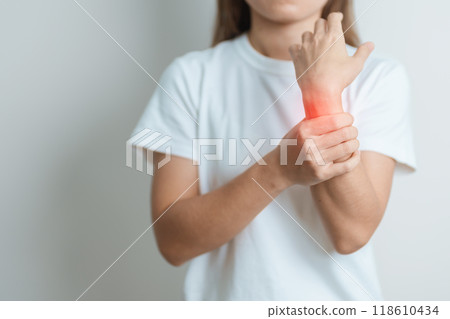Woman having wrist pain at home, muscle ache due to De Quervain s tenosynovitis, ergonomic, Carpal Tunnel Syndrome or Office syndrome and Parkinson disease concept Woman having wrist pain at home, muscle ache due to De Quervain s tenosynovitis, ergonomic, Carpal Tunnel Syndrome or Office syndrome and Parkinson disease concept 118610434