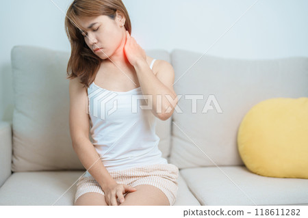 Woman having Neck and Shoulder pain at home. Muscle painful due to Myofascial pain syndrome and Fibromyalgia, rheumatism, Scapular pain, Cervical Spine. ergonomic concept 118611282