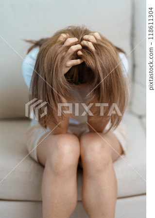 Stress, Sad and unhappy concepts. Alone asian Woman having headache, Young female feeling frustrated, exhausted and suffering Stress, Sad and unhappy concepts. Alone asian Woman having headache, Young female feeling frustrated, exhausted and suffering 118611304