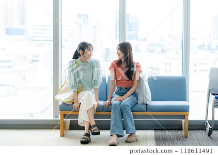 College students chatting at school. Photo courtesy of Denpa Gakuen, Tokyo Electronics College. 118611491