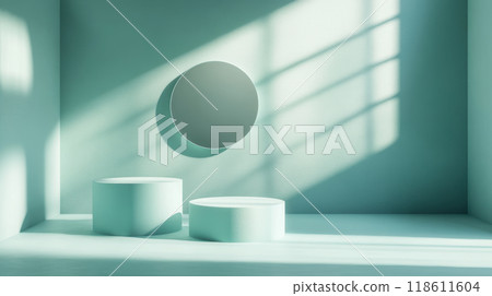 Minimalist design with two circular shapes and round mirror in soft green room, illuminated by natural light creating gentle shadows 118611604