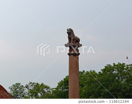 Lion statues of the Ashoka Pillar at the ruins of a monastery in Vaishali, one of the sacred Buddhist sites in India, a sacred place for the offering of honey to monkeys 118612284