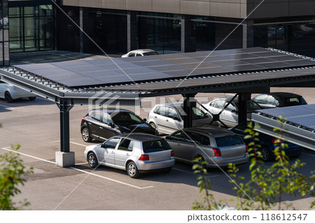 Parking space with solar panels on a roof 118612547