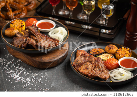 Portion of grilled meat with vegetables Portion of grilled meat with vegetables 118612662