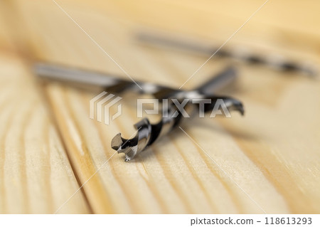 pine wood and metal drill bit for construction work 118613293