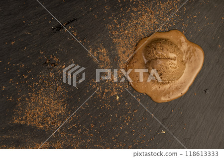 chocolate ice cream with chocolate chips on black slate chocolate ice cream with chocolate chips on black slate 118613333