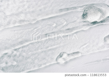Transparent gel texture on a white background. Transparent gel texture on a white background. 118613553