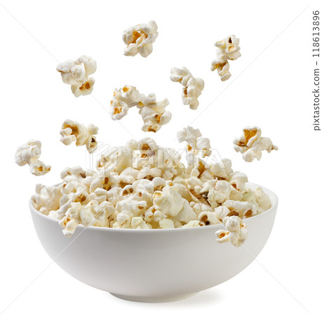 Popcorn falling into a plate on a white background. Isolated Popcorn falling into a plate on a white background. Isolated 118613896