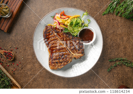 Portion of grilled beef t bone steak 118614234