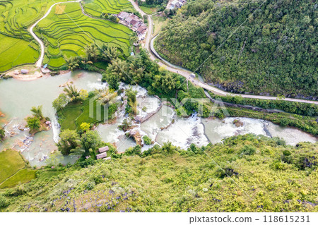 Aerial landscape in Quay Son river, Trung Khanh, Cao Bang, Vietnam with nature, green rice fields and rustic indigenous houses Aerial landscape in Quay Son river, Trung Khanh, Cao Bang, Vietnam with nature, green rice fields and rustic indigenous houses 118615231