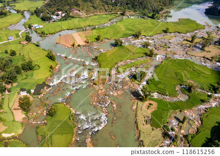 Aerial landscape in Quay Son river, Trung Khanh, Cao Bang, Vietnam with nature, green rice fields and rustic indigenous houses. Aerial landscape in Quay Son river, Trung Khanh, Cao Bang, Vietnam with nature, green rice fields and rustic indigenous houses. 118615256