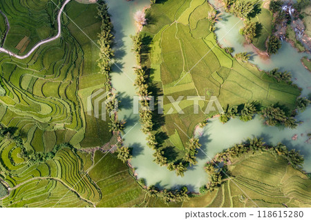 Aerial landscape in Quay Son river, Trung Khanh, Cao Bang, Vietnam with nature, green rice fields and rustic indigenous houses. Aerial landscape in Quay Son river, Trung Khanh, Cao Bang, Vietnam with nature, green rice fields and rustic indigenous houses. 118615280
