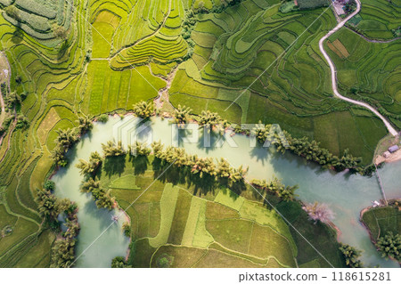 Aerial landscape in Quay Son river, Trung Khanh, Cao Bang, Vietnam with nature, green rice fields and rustic indigenous houses. Aerial landscape in Quay Son river, Trung Khanh, Cao Bang, Vietnam with nature, green rice fields and rustic indigenous houses. 118615281