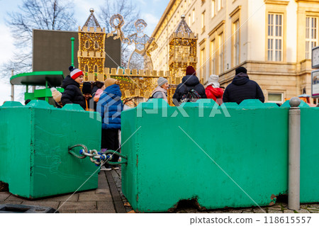 Colorful concrete safety barriers blocks protecting public holiday Christmas market against terror attack attempt. Anti-terror measures in European german city streets 118615557