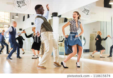 Woman and man dancing swing in studio 118615674