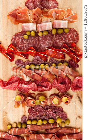 Christmas tree made of sausage on a background of a wooden wall Christmas tree made of sausage on a background of a wooden wall 118615675
