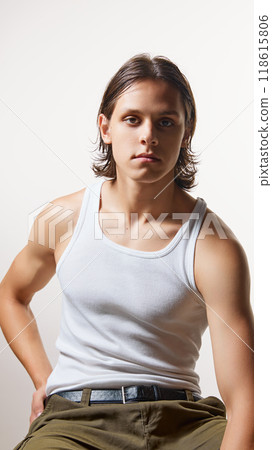 Confident, attractive, stylish young man with athletic physique looking at camera sitting on bar stool against white studio background. Confident, attractive, stylish young man with athletic physique looking at camera sitting on bar stool against white studio background. 118615806