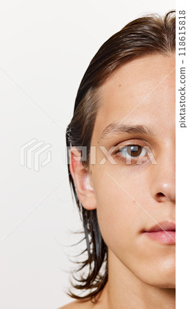 Half-portrait. Detailed photo of young attractive man wet after shower, with well-kept, soft skin against white studio background. 118615818
