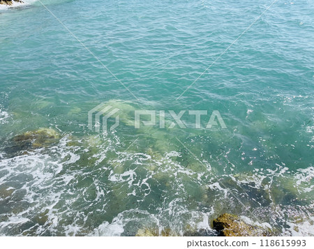 Rocky beach and crystal turquoise water of Ionian Sea in Albania. 118615993
