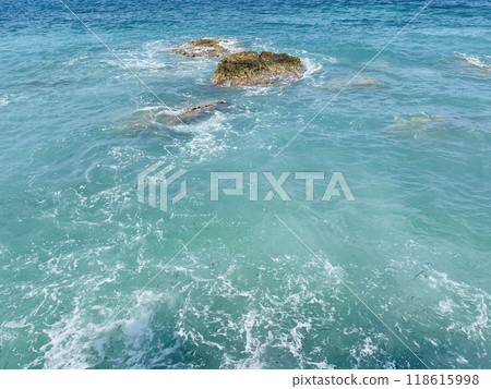 Rocky beach and crystal turquoise water of Ionian Sea in Albania. Rocky beach and crystal turquoise water of Ionian Sea in Albania. 118615998