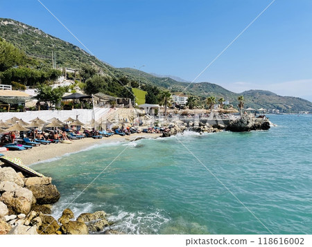 Rocky beach and crystal turquoise water of Ionian Sea in Albania. 118616002