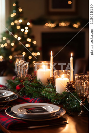 Festive Christmas table setting decorated with candles and garland 118616150