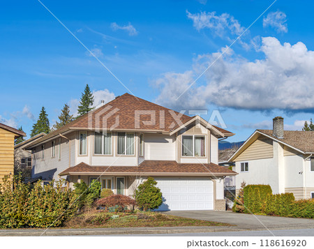 Big residential house on bright winter day in British Columbia 118616920