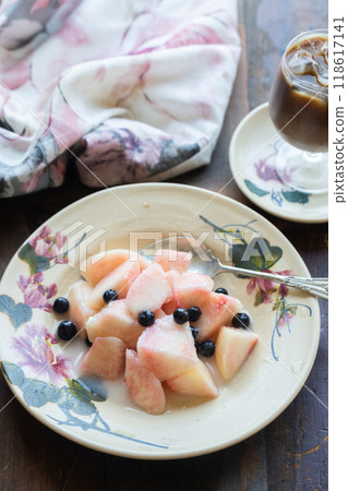 White peach and blueberry dessert 118617141