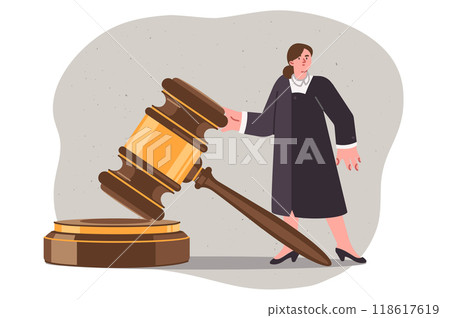 Woman judge makes fair decision for defendant who has broken law, standing near large gavel 118617619