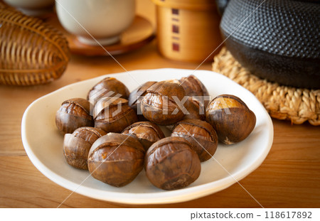 Roasted chestnuts with skin 118617892