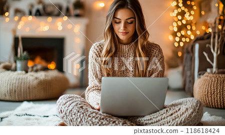 Young Woman Working on Laptop While Sitting Indoors Young Woman Working on Laptop While Sitting Indoors 118618424