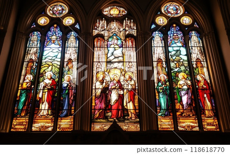 Elaborate stained glass windows in a cathedral, featuring detailed portrayals of biblical figures and religious scenes, framed by Gothic arches Elaborate stained glass windows in a cathedral, featuring detailed portrayals of biblical figures and religious scenes, framed by Gothic arches 118618770