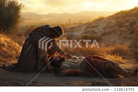 A Samaritan stops to assist a wounded man lying on the desert floor, offering aid and comfort in a striking desert setting bathed in warm, golden light 118618791